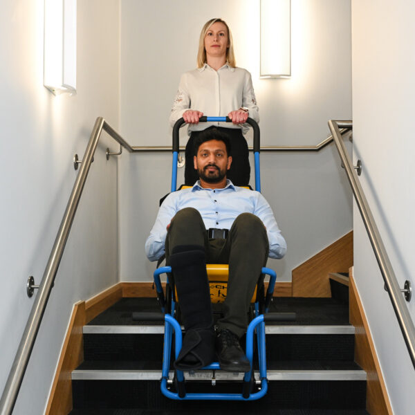 MK5 Evacuation Chair being used to transport user down the stairs